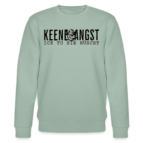 Hell Graugrüner Unisex Sweater mit Rundhalsausschnitt und Berliner Spruch „KEENE ANGST ICK TU SIE NÜSCHT“ in schwarzer Schrift, mittig auf der Brust platziert, ergänzt mit einem grimmig guckenden Cartoon-Engel zwischen den Wörtern