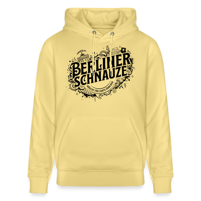 Gelber Bio Unisex Hoodie mit großem schwarzen „Berliner Schnauze – nüscht für zarte Öhrchen“-Print im Streetart‑Stil, inklusive Berliner Wahrzeichen wie Brandenburger Tor und Fernsehturm auf dem Design.