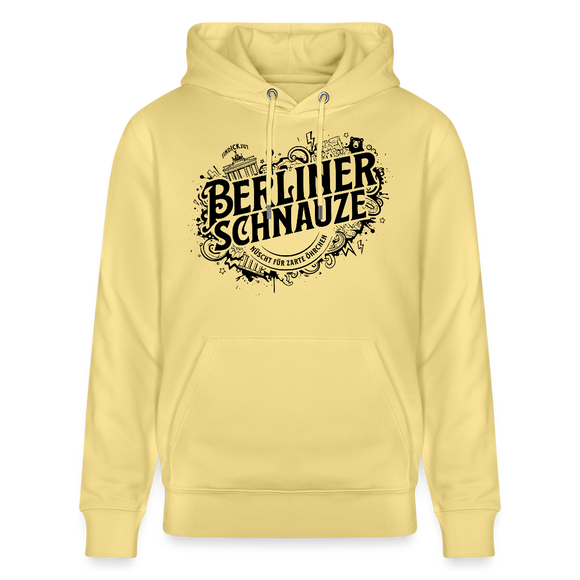 Gelber Bio Unisex Hoodie mit großem schwarzen „Berliner Schnauze – nüscht für zarte Öhrchen“-Print im Streetart‑Stil, inklusive Berliner Wahrzeichen wie Brandenburger Tor und Fernsehturm auf dem Design.