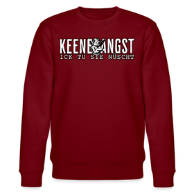 Bordeauxroter Unisex Sweater mit Rundhalsausschnitt und Berliner Spruch „KEENE ANGST ICK TU SIE NÜSCHT“ in weißer Schrift, mittig auf der Brust platziert, ergänzt mit einem Cartoon-Motiv zwischen den Wörtern.
