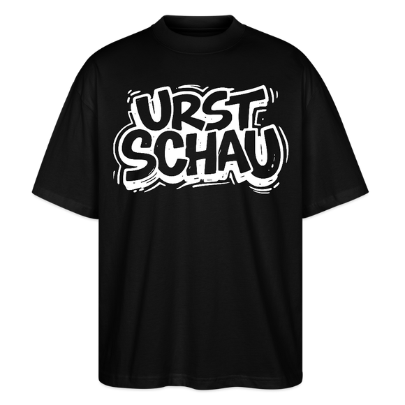 schwarzes Oversized Unisex T-Shirt aus Bio-Baumwolle mit weissem Aufdruck „URST SCHAU“ – Ostalgie Spruch in Berliner Schnauze